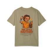 Unisex beige T-shirt featuring Chucky holding a knife and a flaming cocktail with text "The Little Bastard" and a description of Chucky’s signature cocktail.