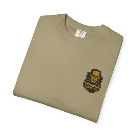 Folded beige Bride of Frankenstein graphic T-shirt with monster logo on chest.