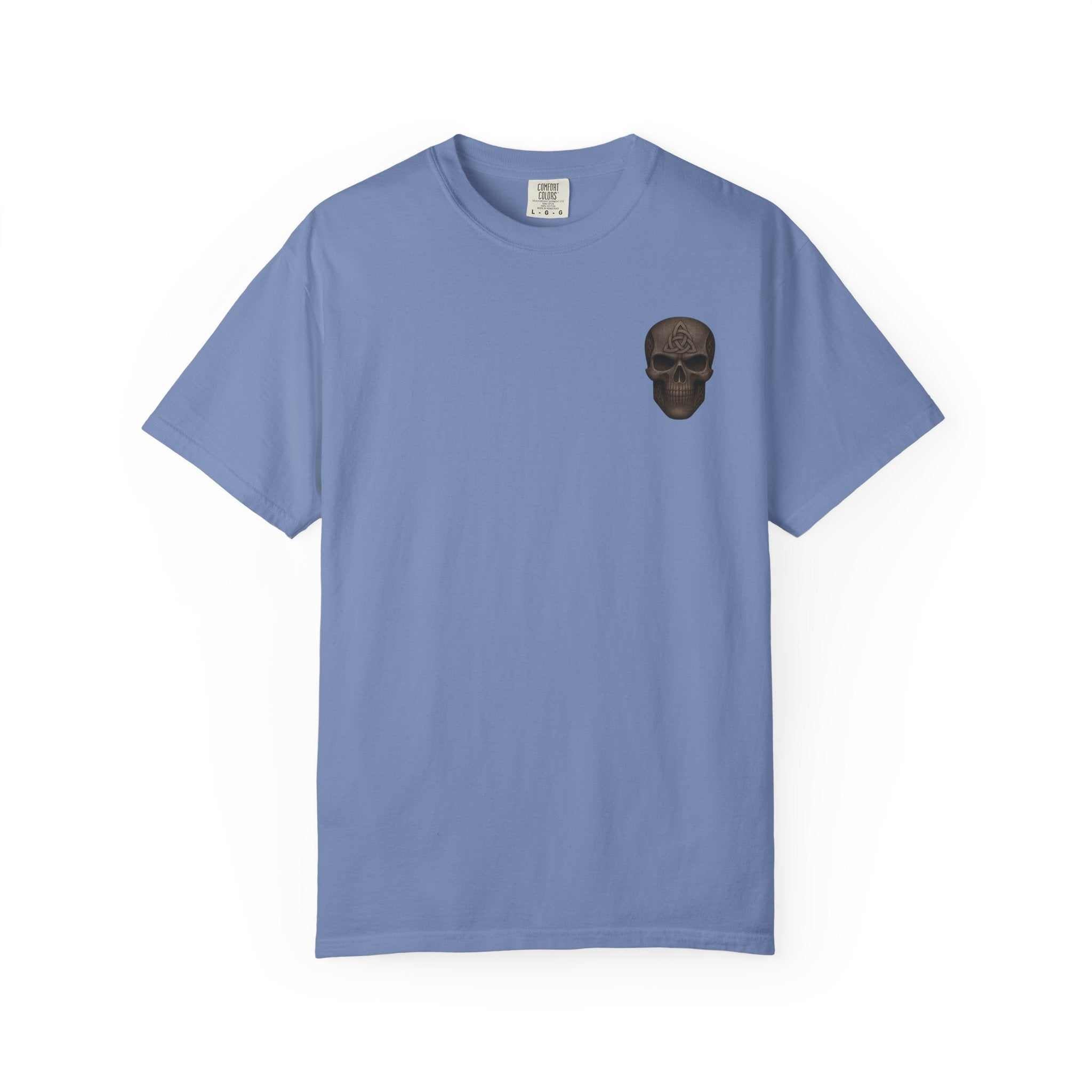 Unisex garment-dyed blue t-shirt with small black skull graphic on chest, made of 100% ring-spun cotton.