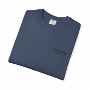 Folded navy blue Chucky Cocktail unisex T-shirt made of soft 100% US cotton with subtle logo print.