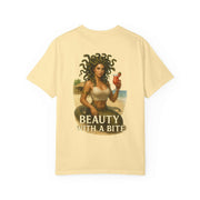 Medusa Beauty unisex T-shirt with Medusa holding a strawberry daiquiri and "Beauty with a Bite" text on a light beige background