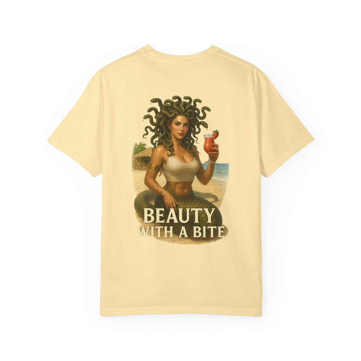 Medusa Beauty unisex T-shirt with Medusa holding a strawberry daiquiri and "Beauty with a Bite" text on a light beige background