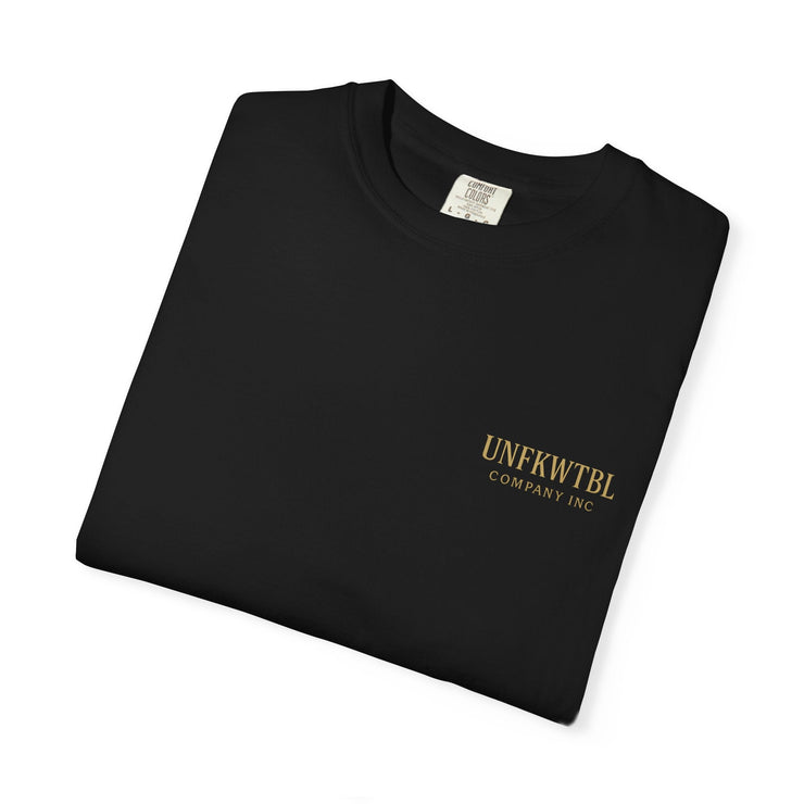 Folded black Medusa Beauty unisex T-shirt with small gold UNFKWTBL logo on front, made of 100% ring-spun cotton.