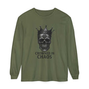 Olive green long sleeve t-shirt featuring a crowned skull graphic with "CROWNED IN CHAOS" text, made from 100% ring-spun cotton.