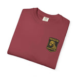 Casual unisex vintage vibe t-shirt with graphic logo in burgundy color folded on white background