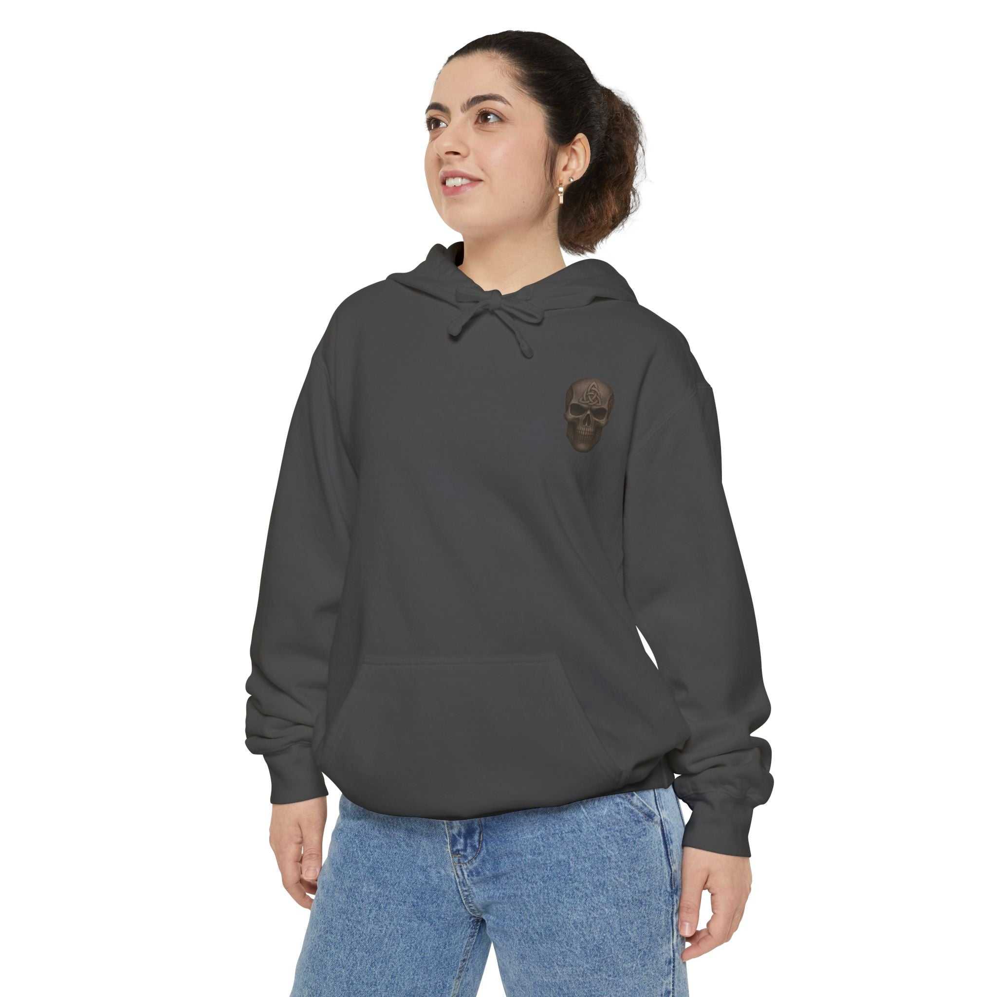Unisex garment-dyed hoodie with 'Never Quit' skull design, soft cotton blend, relaxed fit, and adjustable hood.