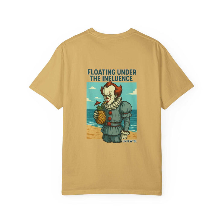Unisex beige t-shirt with humorous Pennywise graphic holding pineapple on beach with text "Floating under the influence"