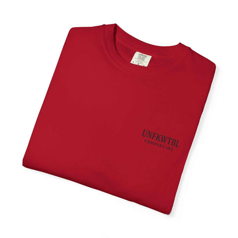 Folded red Chucky Cocktail unisex T-shirt with small black logo text on front, made of 100% US cotton, available in sizes S to 4XL.