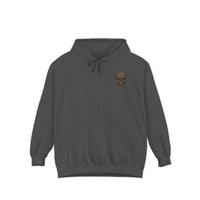 Unisex dark gray garment-dyed hoodie with skull design, cotton-polyester blend, relaxed fit, and front pouch pocket