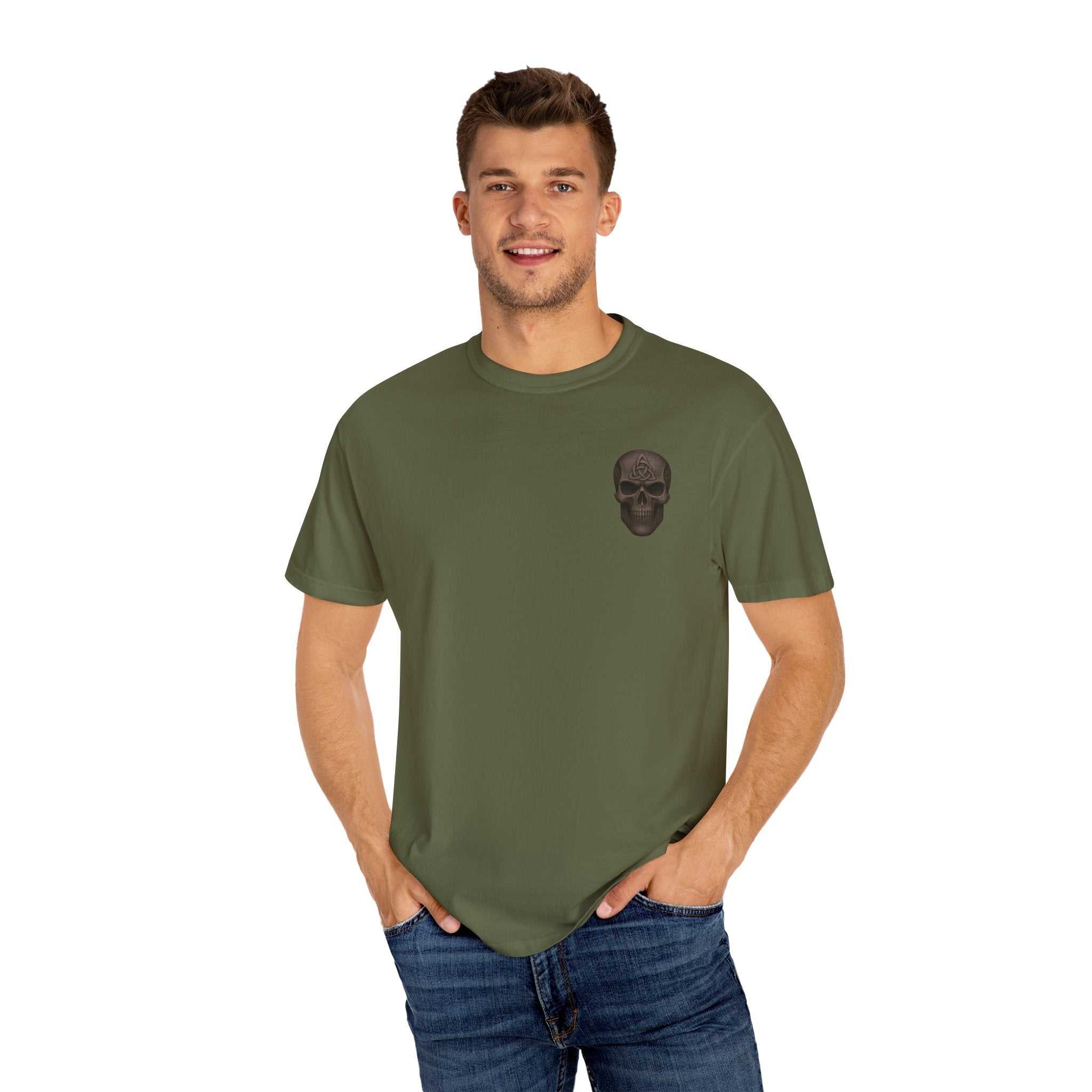 Unisex garment-dyed olive green t-shirt with black skull graphic worn by smiling male model