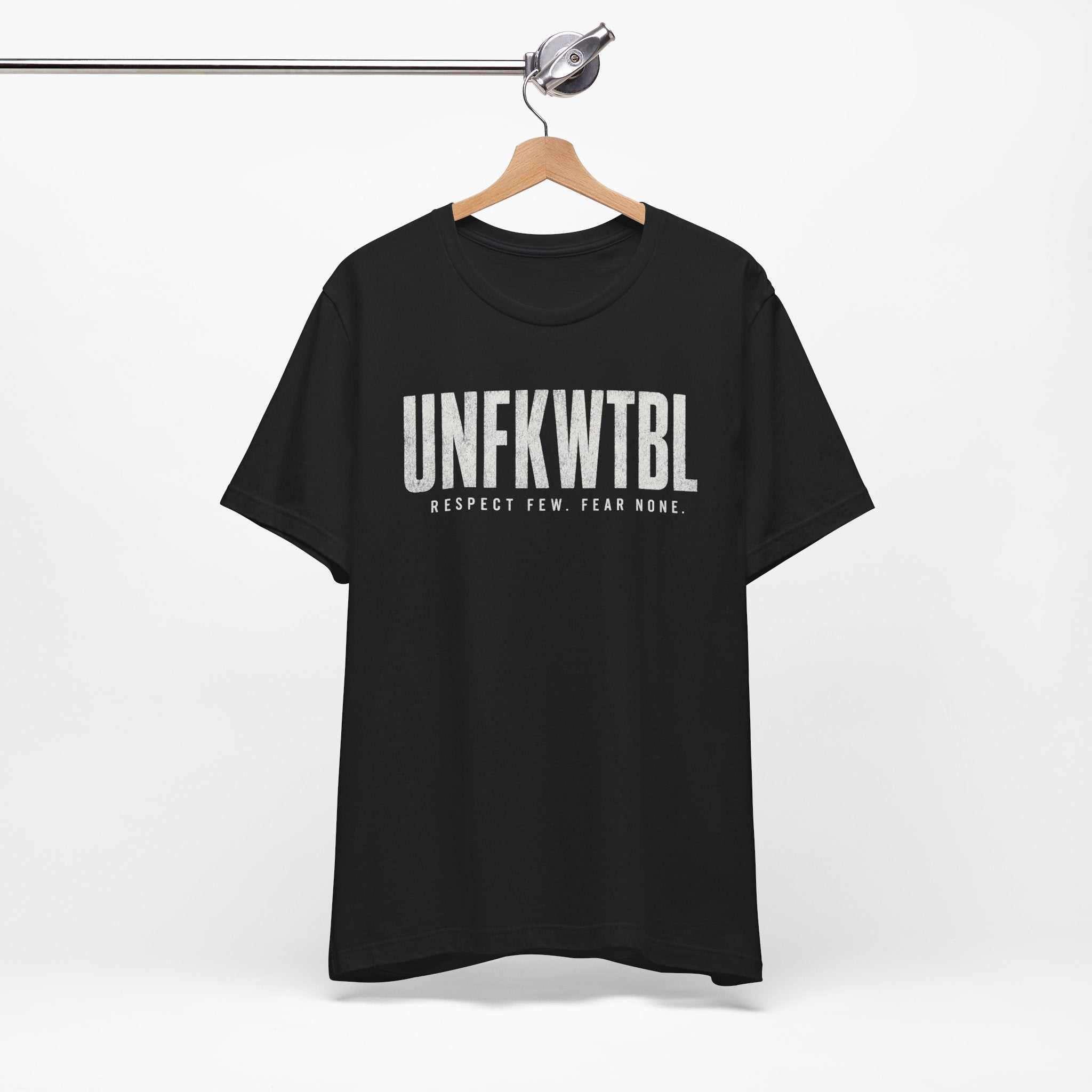 Minimalist UNFKWTBL Respect Few Fear None graphic t-shirt in breathable Airlume cotton with bold block lettering and subtle distress effect