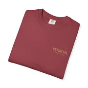 Folded maroon Medusa Beauty T-shirt with strawberry daiquiri design and UNFKWTBL logo on front.