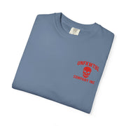 Folded blue graphic tee with red skull logo and text from UNFKWTBL Company Inc.