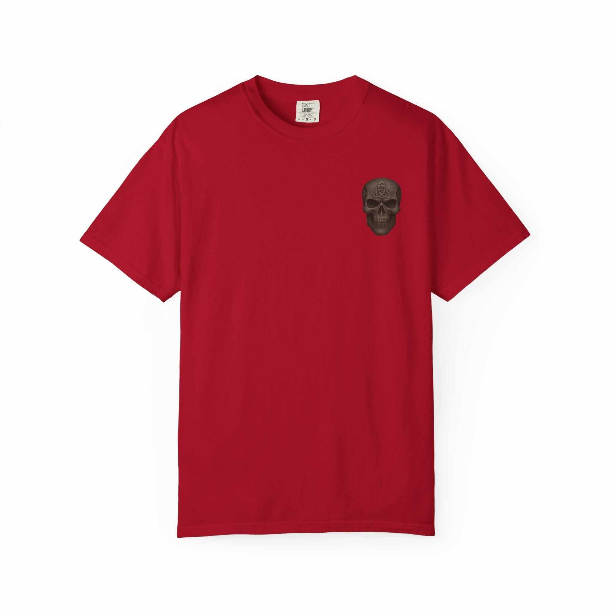 Red unisex garment-dyed t-shirt with small black gladiator skull design on chest, made of 100% ring-spun cotton.