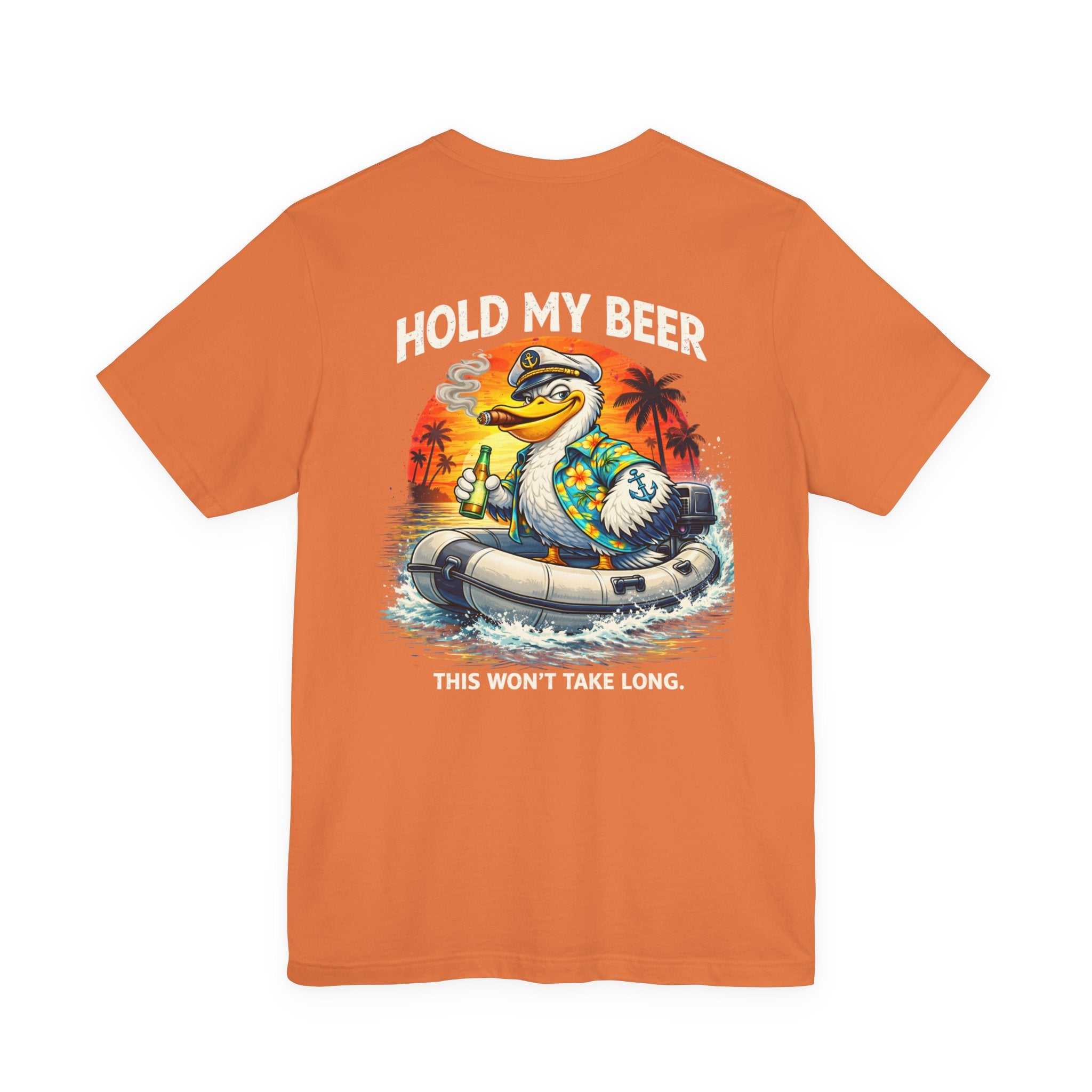 Retro pelican on inflatable tube graphic tee with tropical sunset design