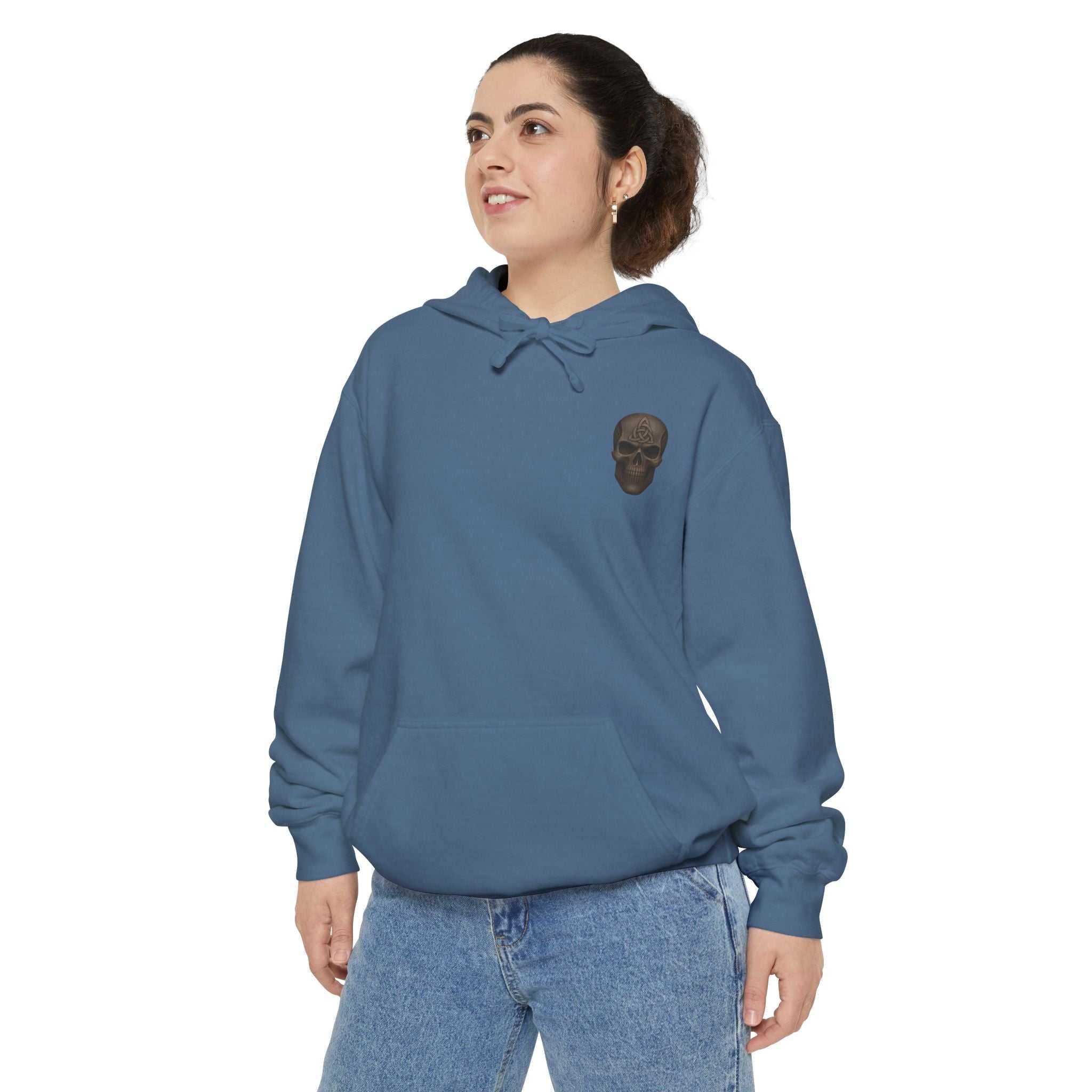 Unisex garment-dyed hoodie in blue with skull graphic, relaxed fit, cotton blend fabric.