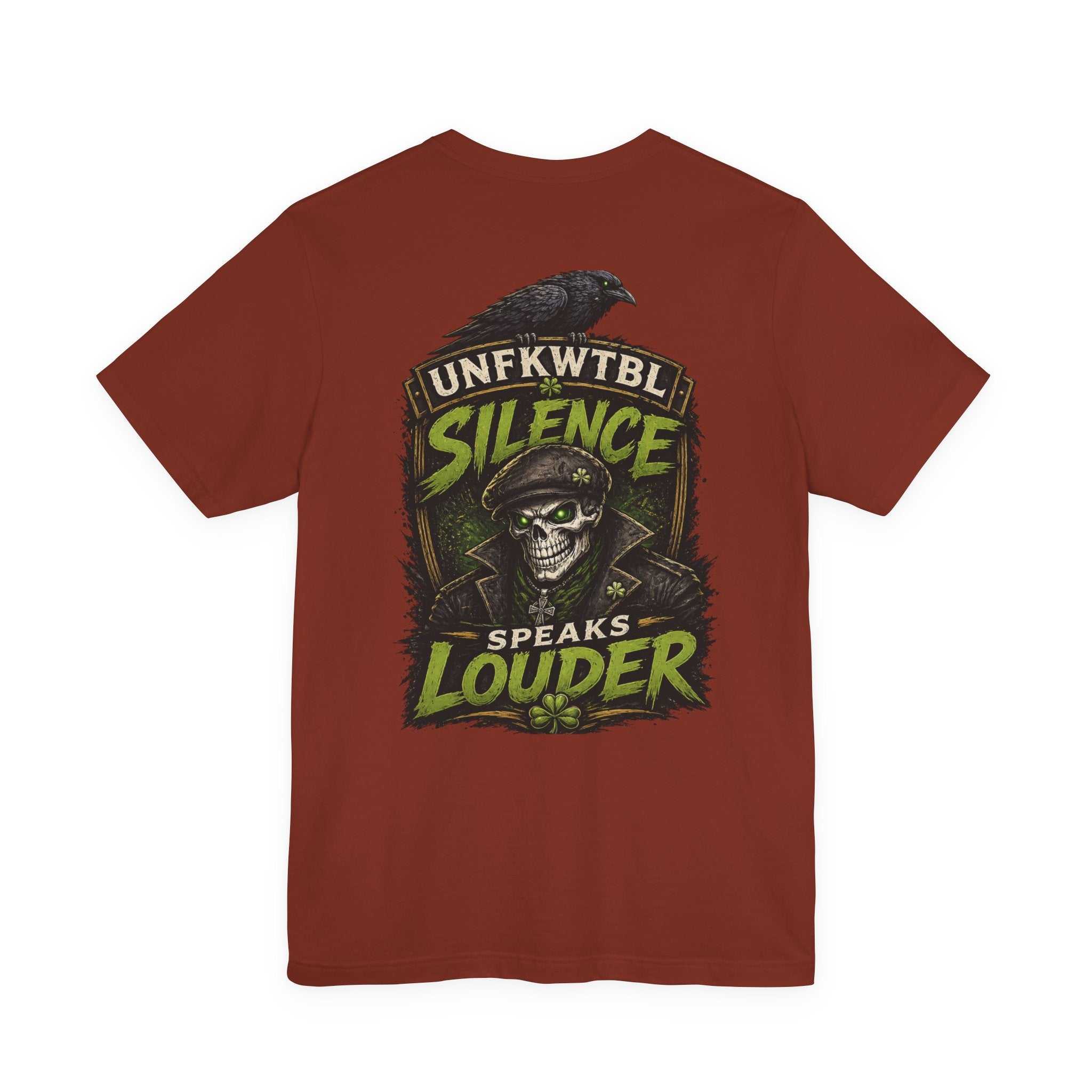 Skull and raven graphic tee with "Silence Speaks Louder" distressed banner on deep rust fabric
