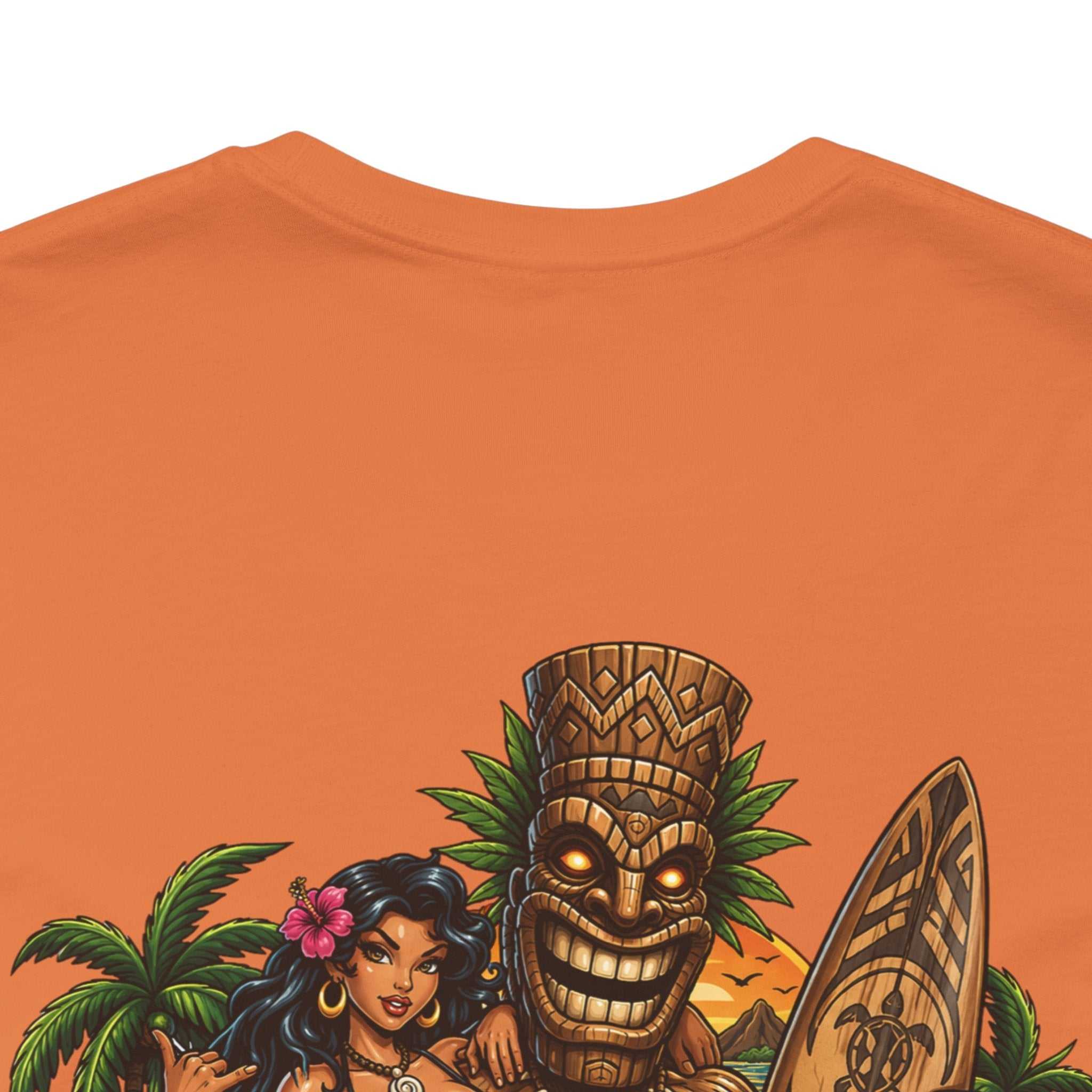Tropical Tiki Tee with tiki, hibiscus flowers, and waves design on a soft, breathable cotton t-shirt perfect for tropical vacations and beachwear