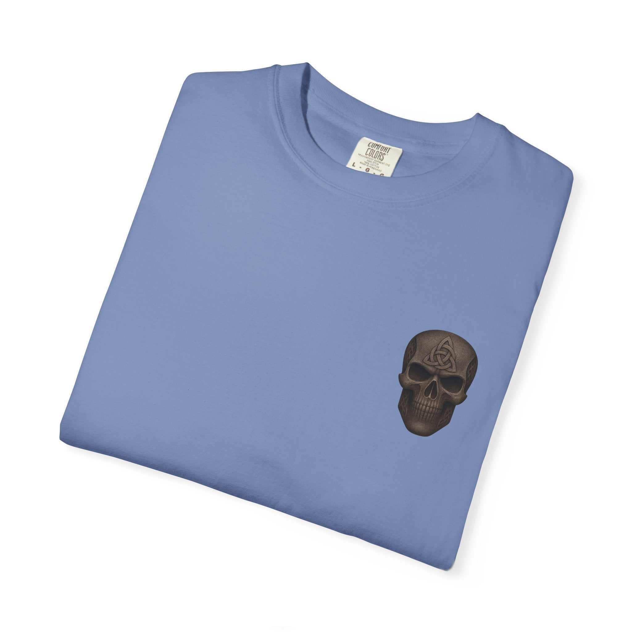 Folded blue vintage-inspired patriotic t-shirt with small black skull graphic on front pocket area