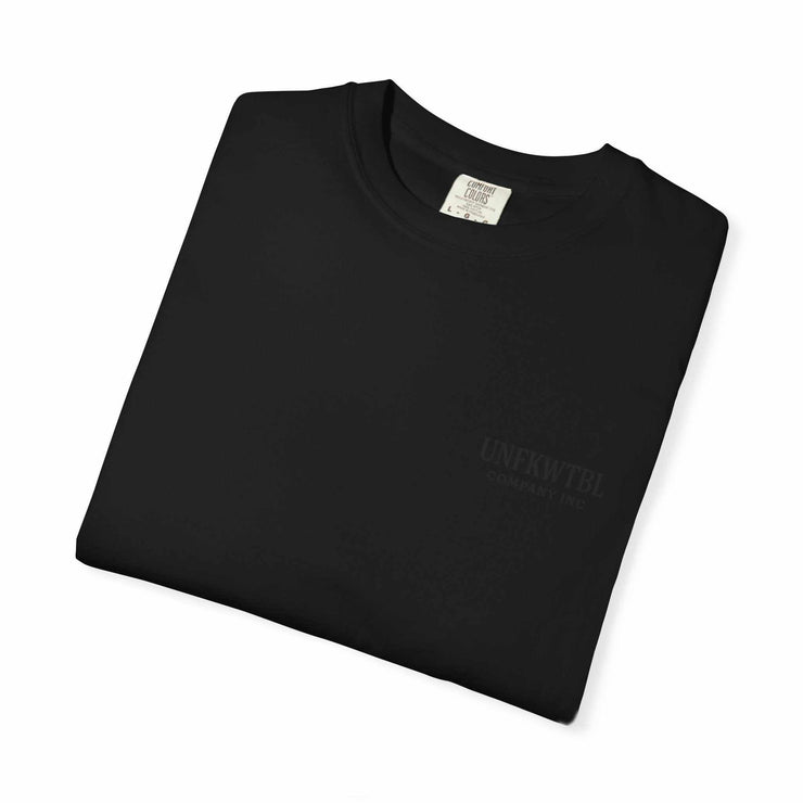 Folded black Chucky Cocktail unisex T-shirt made of 100% US cotton with soft garment-dyed fabric and relaxed fit.