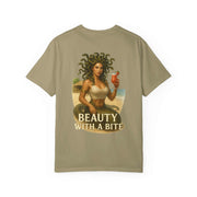 Medusa Beauty Unisex T-shirt with graphic of Medusa holding a strawberry daiquiri and text "Beauty with a Bite" on beige fabric