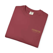 Folded maroon Medusa Beauty unisex T-shirt with strawberry daiquiri design and printed logo on chest.