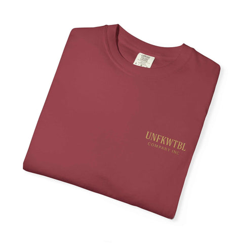 Folded maroon Medusa Beauty unisex T-shirt with strawberry daiquiri design and printed logo on chest.