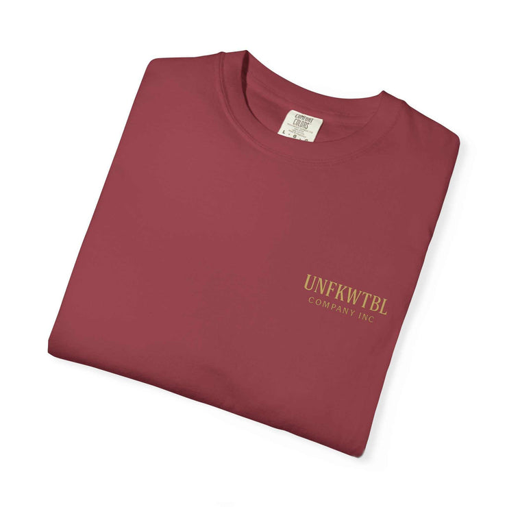 Folded maroon Medusa Beauty unisex T-shirt with strawberry daiquiri design and printed logo on chest.