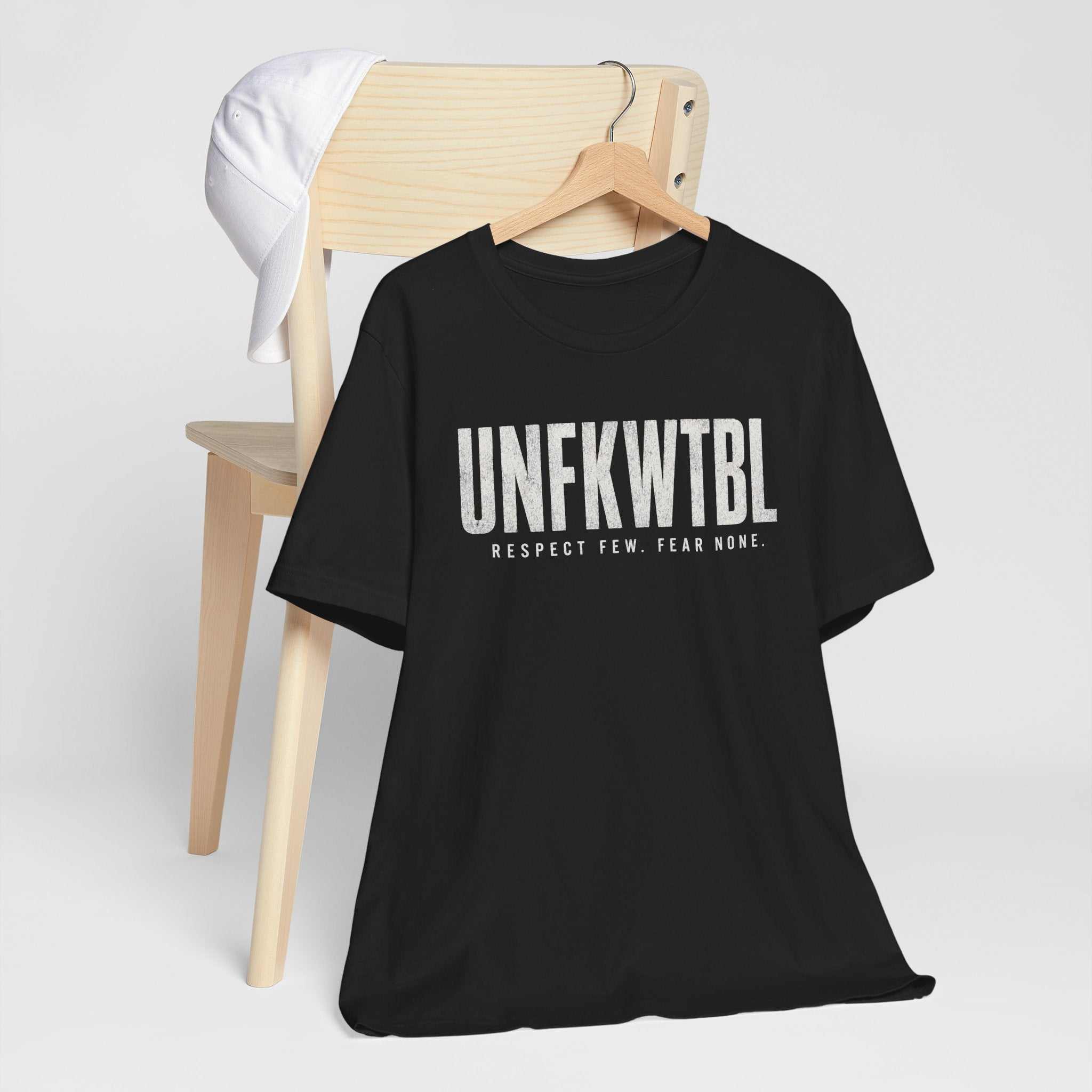 UNFKWTBL Respect Few Fear None graphic t-shirt in minimalist black and white design on breathable Airlume cotton