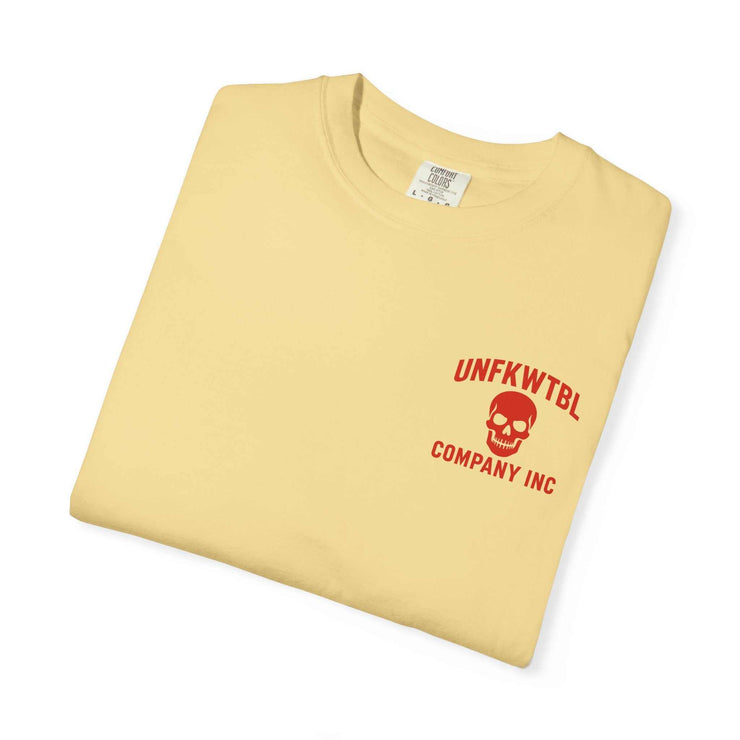 Folded beige graphic tee with red Grim Reaper Hulk mashup logo and text UNFKWTBL Company Inc