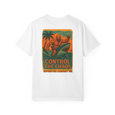 White unisex Control the Chaos garment-dyed t-shirt with vibrant graphic of man wrestling shark on beach, sustainable fashion tee