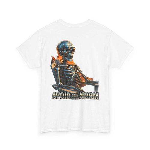 White Beach Vibes Tee with "Avoid the Norm" skeleton graphic relaxing on chair