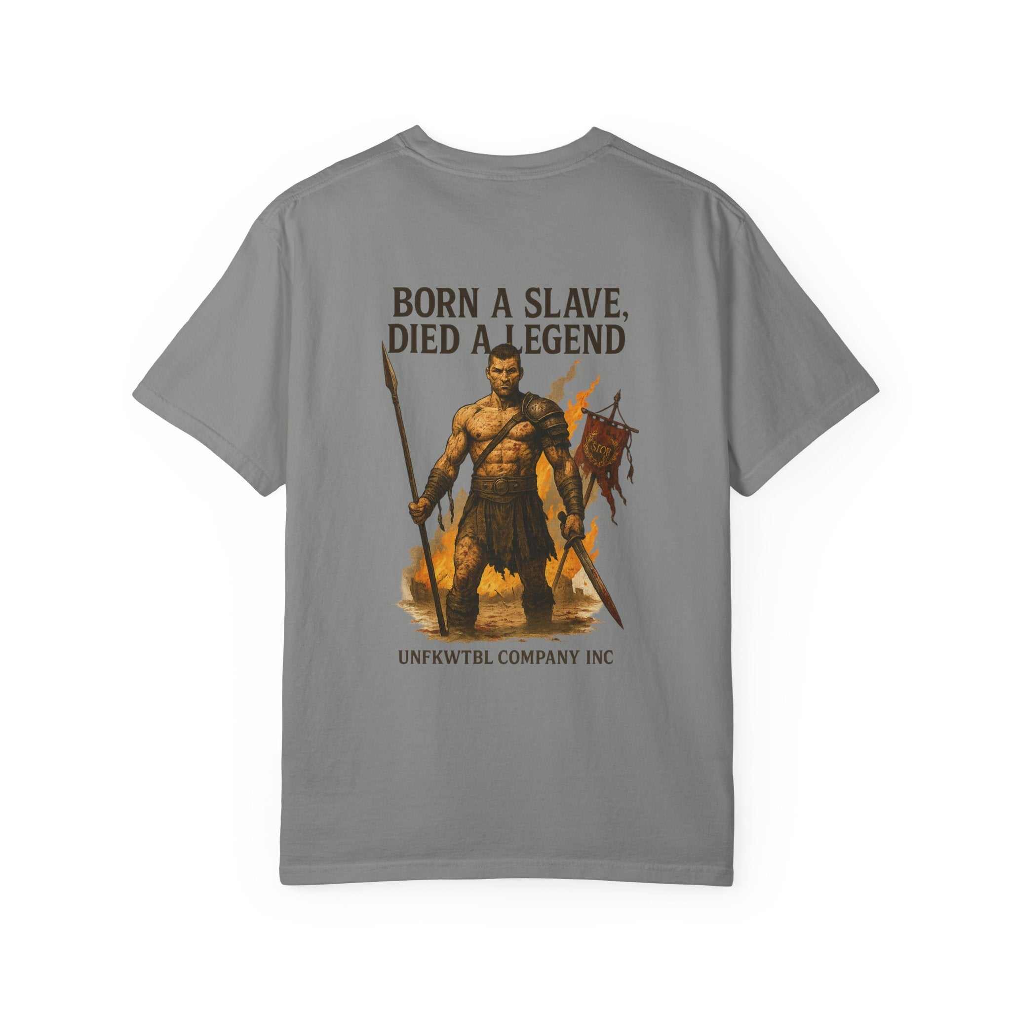 Gray unisex garment-dyed t-shirt featuring a gladiator graphic holding a spear and sword with the text "Born a slave. Died a legend."