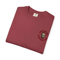 Folded burgundy Jason Voorhees T-shirt with small graphic print on chest showing Jason's mask and company logo